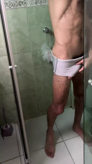 Hairy man with a big, thick dick taking a shower