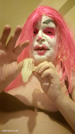 TV clown slut sucking out the contents of a condom thumbnail
