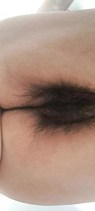 Mature milf&#039;s fat, open, hairy pussy seen from below