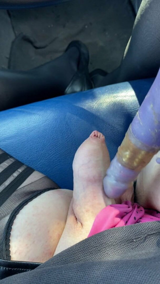 Crossdresser in tights hold ups playing with a dildo
