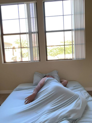 What is he doing? Looks like he is wrestling with his penis quite passionately.