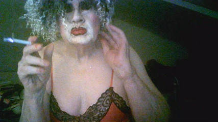 Sarah shitcunt Millward smokes and  flaunts herself for custom, like the whore she is