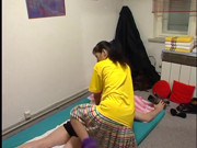 Two thais giving this man a massage