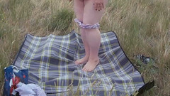Bitch Masturbates Pussy With a Toy in the Field