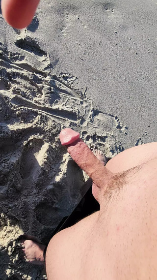 Stroking big thick hard veiny mushroom head outdoor beach cock
