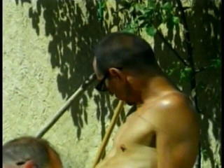Three hunky gay dudes blow each other hard outdoors