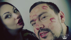 Covering Alex with red shiny lipstick kisses all over his face!
