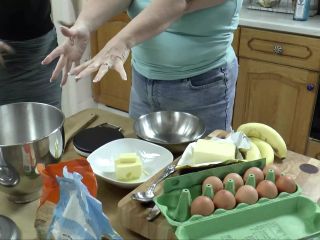 Petite girl bakes with chubby granny