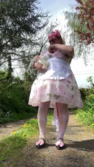 In a pink babydoll outfit for a day