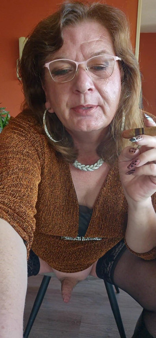 Drinking a nice glass of champagne while enjoying a cigar