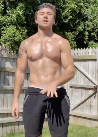 Sexy hot muscle guy dancing with huge bulge in shorts