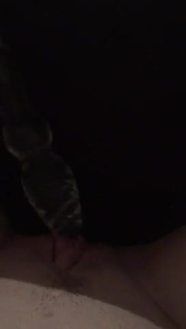 MILF playing with glass dildo