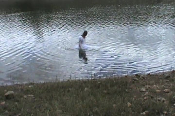 Big wedding gown, wading into a favorite lake.