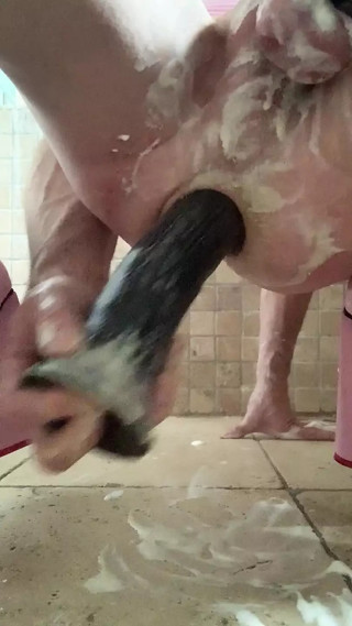 Sissy fucking her ass with a big black dildo, fresh cream and an anal expander