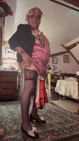 Dressed in a little pink dress for an evening out thumbnail
