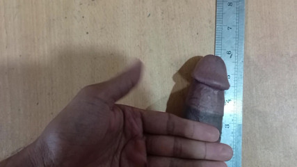 Desi boy Measure your own weight with a scale.