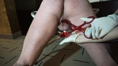 Femdom chick in gloves punishing slaves cock