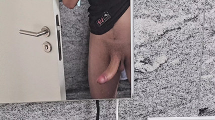 Young man squirts his wall at his home