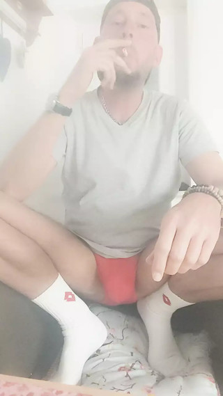 Smoke a cigarette naked