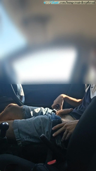 Cumming in a car by the road