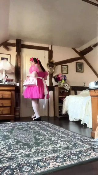Dressed with a fuchsia pink dress and a layer for a day
