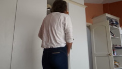 After Urinating, the Stepmother Puts on Very Tight Jeans, Revealing Her Panties