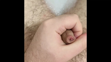 Chubby guy with tight foreskin wanks in the bath with cumshot