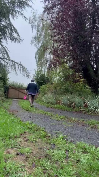 Dressed in a little pink plaid skirt for a party