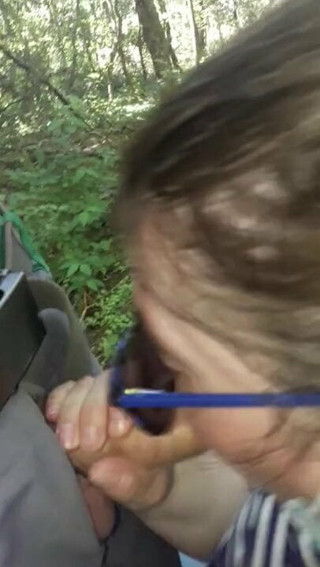 Sandra sucks me at the edge of a wood
