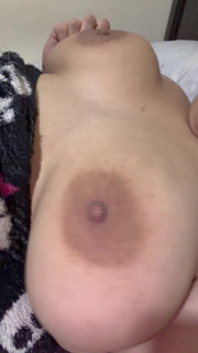 Mom bounces and plays with her huge tits