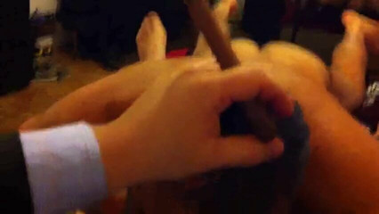 Suited daddy gets sucked as he smokes a big cigar