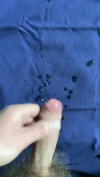 Dude jerks his uncut meat and cums.