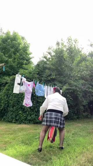 In an outfit with a new blouse on which I've modified the ascot tie to hang my laundry. thumbnail