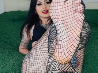 Foot fetish from sexy mistress. Dominatrix Nika in fishnet tights seduces you with her feet and toes. Yes! Kiss and lick