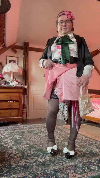 Dressed in a coral mini skirt for her evening thumbnail