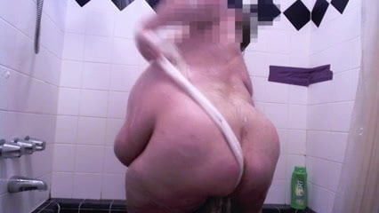 Fat guy taking a shower