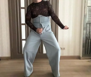 Crossdresser in blue high waist corset jeans, crop top and high heels cum and dance for her BDSM master like a cuckold thumbnail