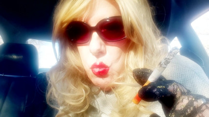 MRS. ROMAN SMOKING MARLBORO 100's IN HER CAR thumbnail