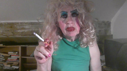 Skanky mature, tgurl fag,  smoking sissy  slut Sarah in cum stained  pink mini skirt and stockings