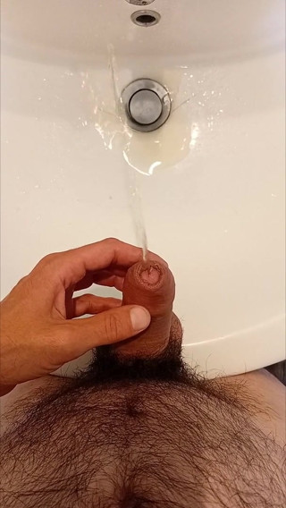 I play with my cock while I pee