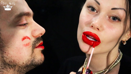 Covering Alex face with red lipsticks kisses