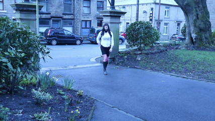 Transvestite outdoors in a park