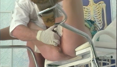Gloved Doctor Stretches Hairy Pussy Wide Open