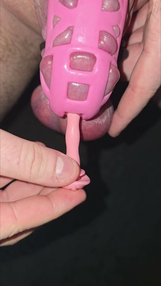 Accidentaly inserting my penis plug all the way into my cock while wearing a pink cock cage and many cock rings around my balls.