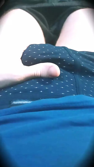 The guy massages his dick through his underpants