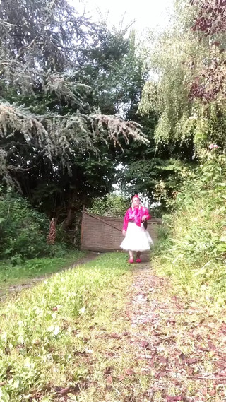 Dressed with a sheer petticoat and a fuchsia blouse for a day