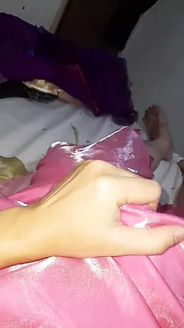 Crossdresser wearing long satin prom pink dress