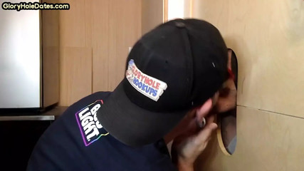 Gray DILF wanking dick while giving gloryhole blowjob