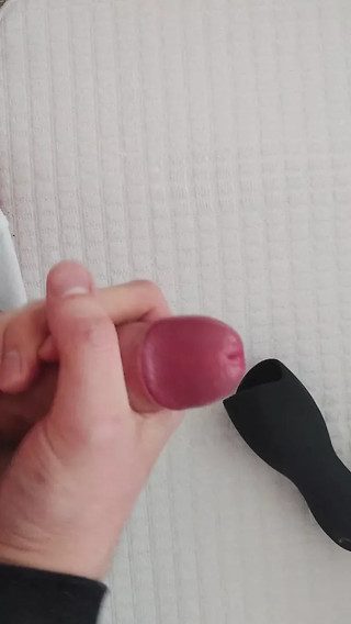 having fun and massaging his penis