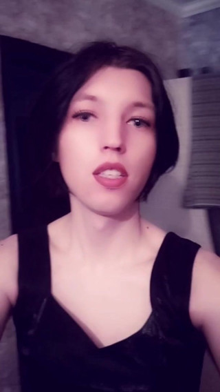 Dinara Artenysova short posing in front of camera